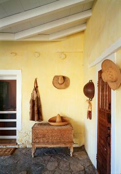 Peter Hurd's origional  hats and chaps are displayed on the portal of Peter Hurd/Henriette Wheth's home (built 1930) in San Patricio, NM, 2002